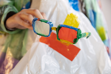 Image showing Woman addicted of sales and clothes, wearing plastic, recycling 