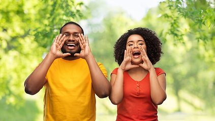 Image showing happy african american couple calling