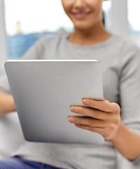Image showing close up of woman with tablet pc computer at home