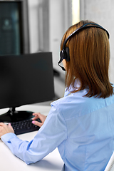 Image showing businesswoman with headset and computer at office