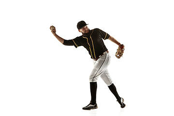 Image showing Baseball player, pitcher in a black uniform practicing on a white background.