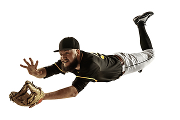 Image showing Baseball player, pitcher in a black uniform practicing on a white background.