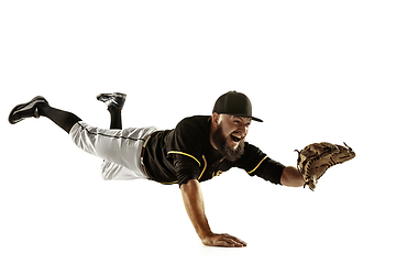 Image showing Baseball player, pitcher in a black uniform practicing on a white background.