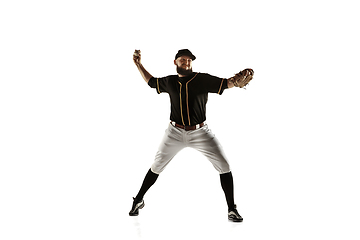 Image showing Baseball player, pitcher in a black uniform practicing on a white background.