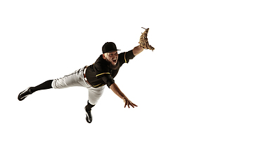 Image showing Baseball player, pitcher in a black uniform practicing on a white background.