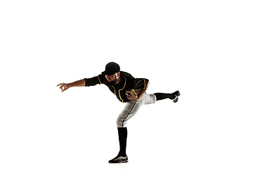 Image showing Baseball player, pitcher in a black uniform practicing on a white background.