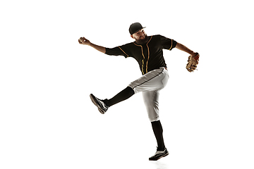 Image showing Baseball player, pitcher in a black uniform practicing on a white background.