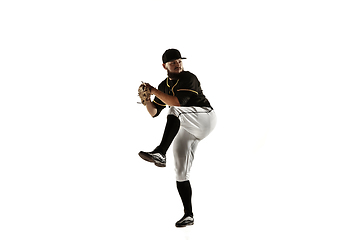 Image showing Baseball player, pitcher in a black uniform practicing on a white background.