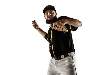 Image showing Baseball player, pitcher in a black uniform practicing on a white background.