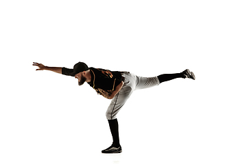 Image showing Baseball player, pitcher in a black uniform practicing on a white background.