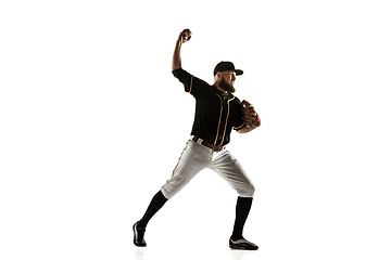 Image showing Baseball player, pitcher in a black uniform practicing on a white background.