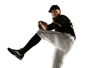 Image showing Baseball player, pitcher in a black uniform practicing on a white background.