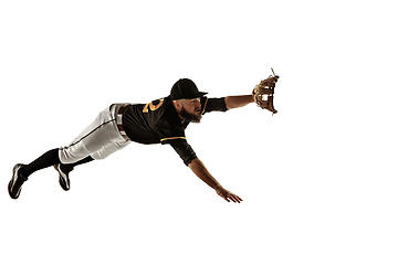 Image showing Baseball player, pitcher in a black uniform practicing on a white background.