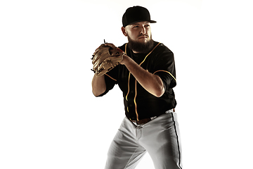 Image showing Baseball player, pitcher in a black uniform practicing on a white background.