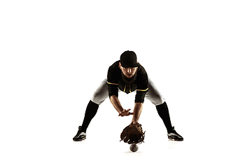 Image showing Baseball player, pitcher in a black uniform practicing on a white background.