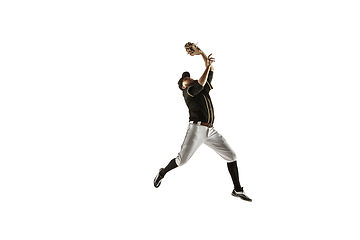 Image showing Baseball player, pitcher in a black uniform practicing on a white background.