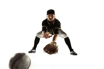 Image showing Baseball player, pitcher in a black uniform practicing on a white background.