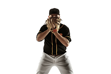 Image showing Baseball player, pitcher in a black uniform practicing on a white background.