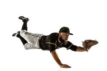 Image showing Baseball player, pitcher in a black uniform practicing on a white background.