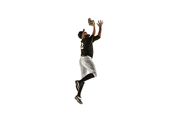 Image showing Baseball player, pitcher in a black uniform practicing on a white background.