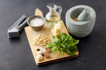 Image showing ingredients for basil pesto sauce on wooden board