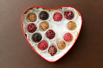 Image showing candies in red heart shaped chocolate box