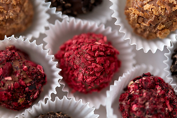 Image showing close up of different candies in paper cups