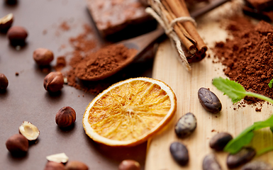 Image showing chocolate with hazelnuts, cocoa beans and orange