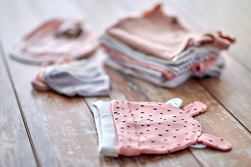 Image showing close up of baby clothes on wooden table