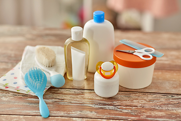 Image showing baby accessories for bathing on wooden table