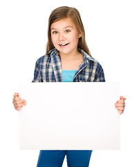 Image showing Little girl is holding a blank banner