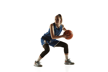 Image showing Young caucasian female basketball player against white studio background