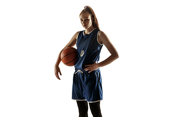 Image showing Young caucasian female basketball player against white studio background