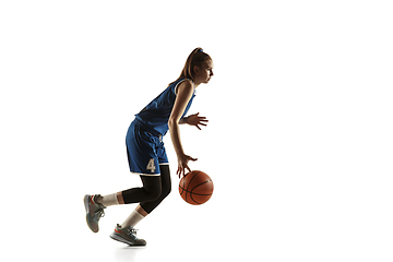 Image showing Young caucasian female basketball player against white studio background