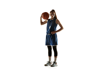 Image showing Young caucasian female basketball player against white studio background