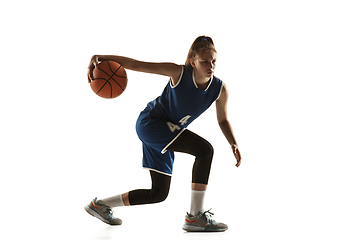 Image showing Young caucasian female basketball player against white studio background