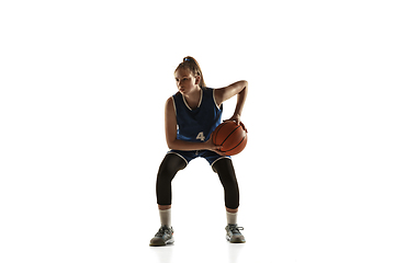 Image showing Young caucasian female basketball player against white studio background