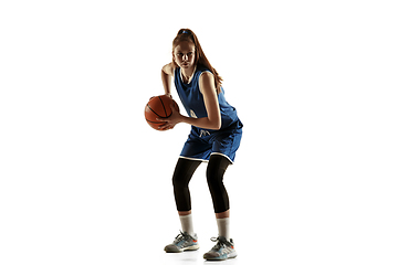 Image showing Young caucasian female basketball player against white studio background