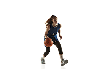 Image showing Young caucasian female basketball player against white studio background