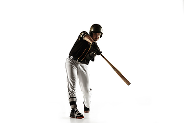 Image showing Baseball player, pitcher in a black uniform practicing on a white background.