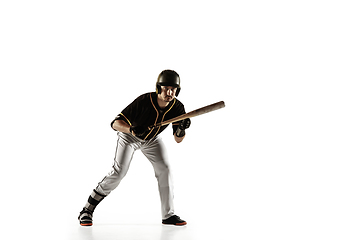 Image showing Baseball player, pitcher in a black uniform practicing on a white background.