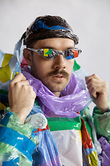 Image showing Man addicted of sales and clothes, wearing plastic, recycling concept