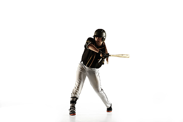 Image showing Baseball player, pitcher in a black uniform practicing on a white background.