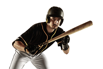 Image showing Baseball player, pitcher in a black uniform practicing on a white background.