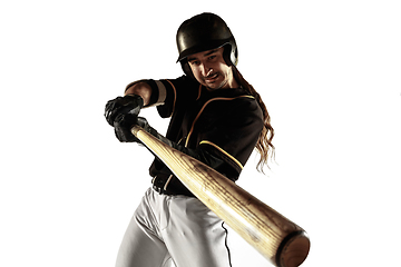 Image showing Baseball player, pitcher in a black uniform practicing on a white background.