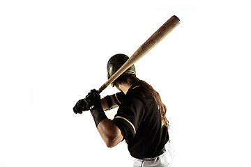 Image showing Baseball player, pitcher in a black uniform practicing on a white background.