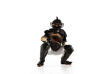 Image showing Baseball player, pitcher in a black uniform practicing on a white background.