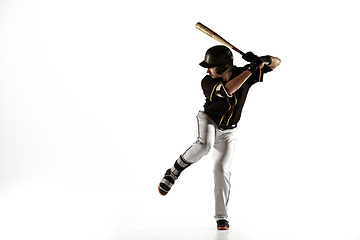 Image showing Baseball player, pitcher in a black uniform practicing on a white background.