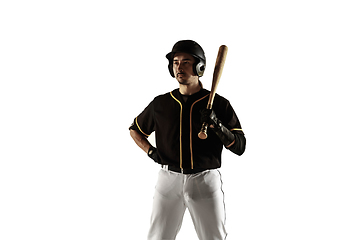 Image showing Baseball player, pitcher in a black uniform practicing on a white background.