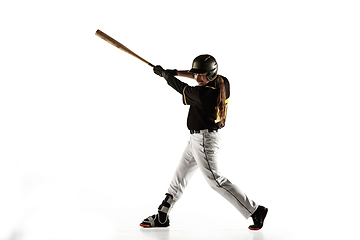 Image showing Baseball player, pitcher in a black uniform practicing on a white background.